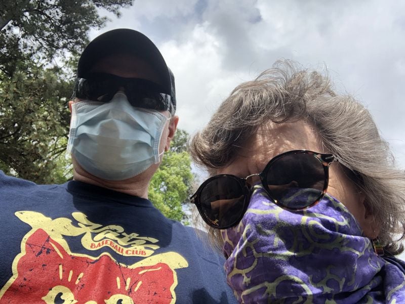 Jim and Pam Auchmutey are suited up for a neighborhood walk during the pandemic. “Friends have suggested we look like we’re getting ready to stage a holdup,” he said. CONTRIBUTED BY JIM AUCHMUTEY