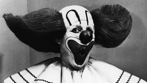 Promotional portrait of Bozo the Clown holding boxes of Bozo Express Bazooka bubble gum with a surprised expression on his face, circa 1965. Frank Avruch, who portrayed the clown, died at age 89. (Photo by Hulton Archive/Getty Images)