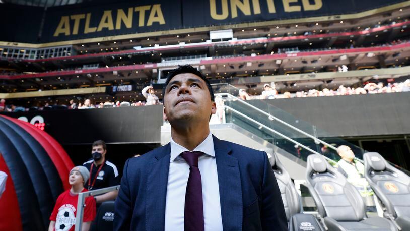 Atlanta United head coach Gonzalo Pineda looks at the screens before the season finale game against the New York City FC at Mercedes-Benz Stadium on Sunday. Miguel Martinez / miguel.martinezjimenez@ajc.com