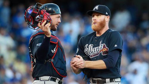 Braves starting pitcher Mike Foltynewicz talks with catcher Tyler Flowers after loading the bases in the first inning against the Los Angeles Dodgers during Game One of the NLDS Thursday, October 4, 2018, in Los Angeles, Ca. Curtis Compton/ccompton@ajc.com
