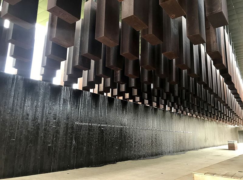 Stone markers hang high at the National Memorial for Peace and Justice in Montgomery, Ala. The markers recognize recorded lynchings that took place in Georgia and other Southern states. TIA MITCHELL / TIA.MITCHELL@AJC.COM