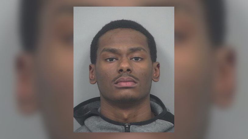 Tariq Strickland, 23, of Lilburn, is being sought by Gwinnett County police after he was charged with murder in the shooting death of 30-year-old Denzel Romanie.