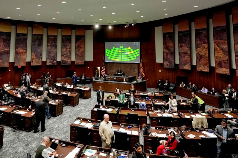 Arizona state representatives convene on House floor at the Capitol, Wednesday, April 10, 2024, in Phoenix. The Arizona Supreme Court ruled Tuesday that the state can enforce its long-dormant law criminalizing all abortions except when a mother's life is at stake. (AP Photo/Matt York)