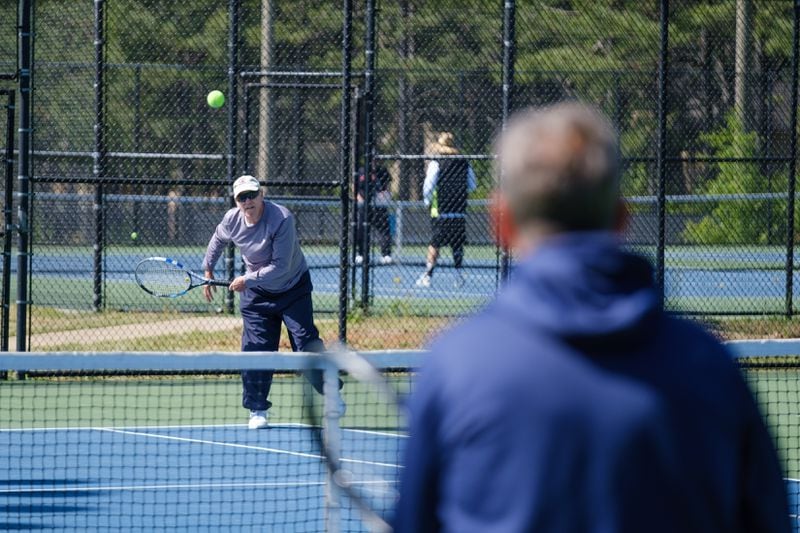 Bill Hill plays tennis at Lost Mountain Park in Cobb County on Wednesday, April 20, 2022. (Arvin Temkar / arvin.temkar@ajc.com)