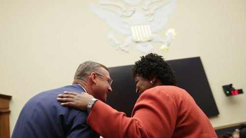 U.S. Rep. Doug Collins, R-Gainesville, talks to Democrat Stacey Abrams prior to a hearing Tuesday before a House Judiciary subcommittee in Washington. Abrams testified in favor of restoring federal pre-clearance of voting changes by states, such as Georgia, with histories of voting discrimination under the 1965 Voting Rights Act. (Photo by Alex Wong/Getty Images)