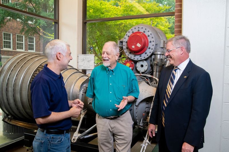 Bob Macdonald (center) is with Joel Sokol, director of Georgia Tech’s Master of Science in Analytics program, and Nelson Baker, dean of professional education, in front of the Rocketdyne H-1A engine in the Daniel Guggenheim School of Aerospace Engineering. Macdonald worked for Rocketdyne in the 1960s during the Apollo program. CONTRIBUTED BY CHRISTOPHER MOORE / GEORGIA INSTITUTE OF TECHNOLOGY
