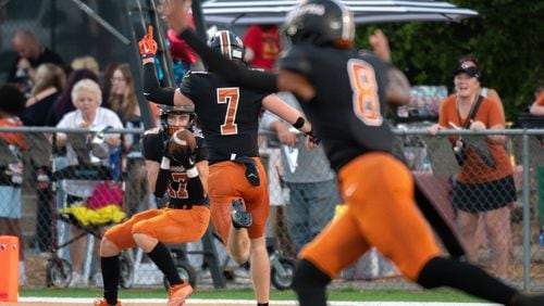 Landon Mayes for Sprayberry makes a touchdown pass during the Kell v Sprayberry football game September 8, 2023. (Jamie Spaar for the Atlanta Journal Constitution)