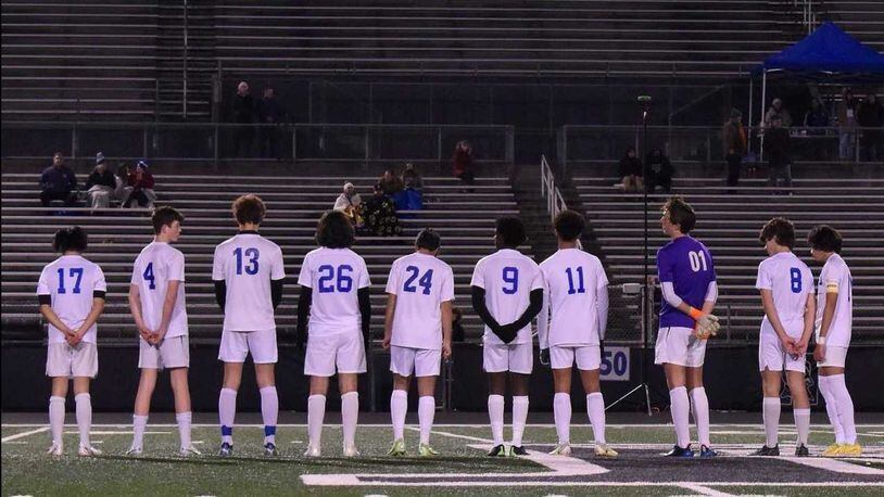 Members of the Paideia School boys' soccer team stand before a recent match. School officials and parents say some of the players were called a racial slur by their opponents during a state semifinal matchup. Photo Credit: The Paideia School.