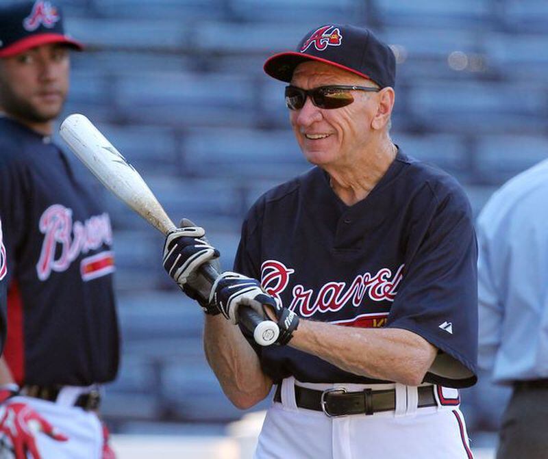 Bobby Dews hitting infield fungoes before a game in 2010. (Curtis Compton/AJC)