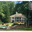 The house Shirley and Russell Dermond owned on Lake Oconee until their deaths in May 2014. The house, pictured here in 2017, overlooks a cove in the Great Waters subdivision in northeastern Putnam County, about an hour's drive from downtown Atlanta. (Joe Kovac Jr. / AJC)