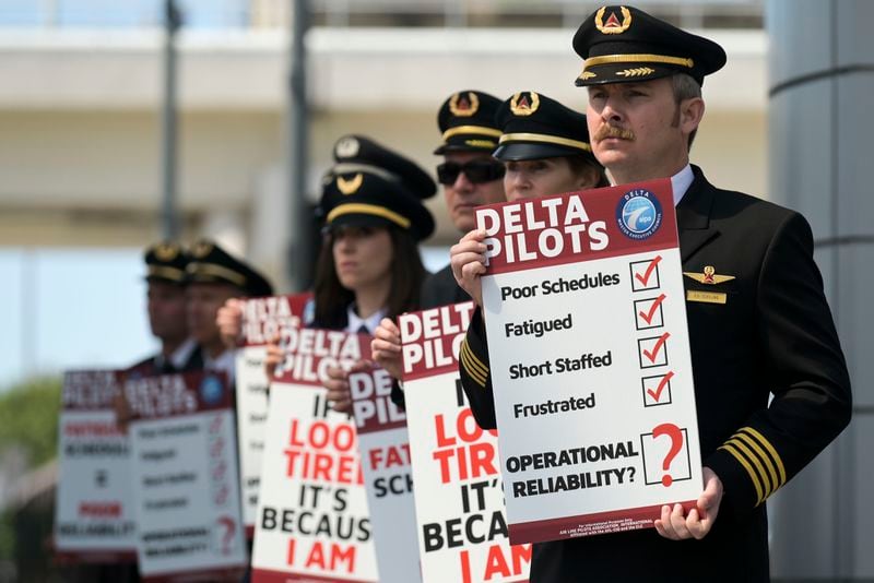 Delta Airlines pilots are seen picketing at the south terminal of Hartsfield-Jackson International Airport Thursday, March 10, 2022. The pilots are members of the Delta Airlines Pilots Association and protesting fatiguing schedules. (Daniel Varnado/For the Atlanta Journal-Constitution)