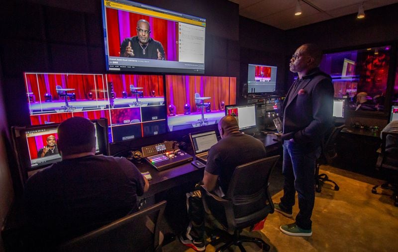 Elizabeth Baptist Church’s pastor, Dr. Craig L. Oliver Sr. (right), watches the e-service broadcast from the Atlanta church on Sunday, March 15, 2020.   (Photo: STEVE SCHAEFER / SPECIAL TO THE AJC)