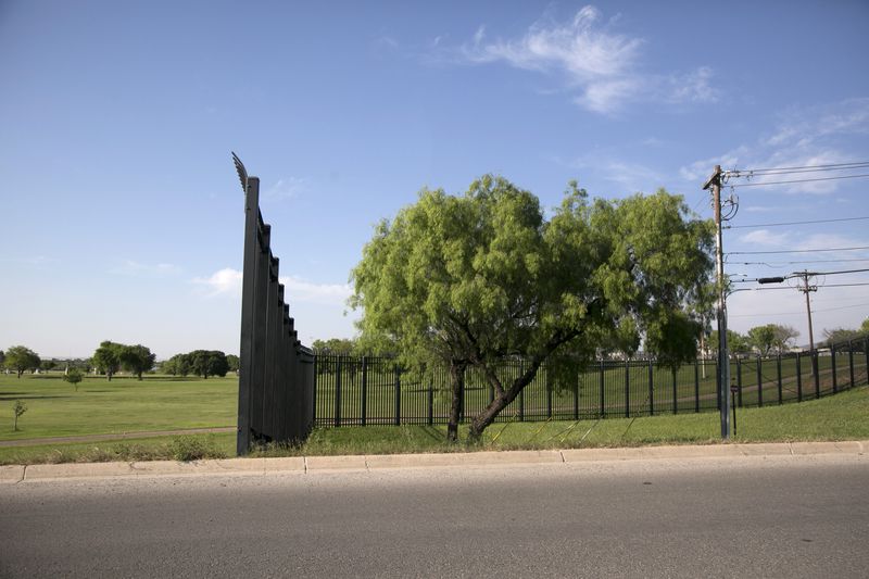 During George W. Bush's administration, the federal government built nearly 700 miles of fence along the 2,000-mile U.S.-Mexico border. In the small border town of Eagle Pass, Texas, the wall cuts through nearly two miles of downtown and leaves the city's golf course and parkland in what some see as a no man's land between the fence and the river. 