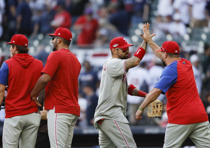 Philadelphia Phillies' Nick Castellanos celebrates with teammates after winning game one of the baseball playoff series between the Braves and the Phillies at Truist Park in Atlanta on Tuesday, October 11, 2022. (Jason Getz / Jason.Getz@ajc.com)