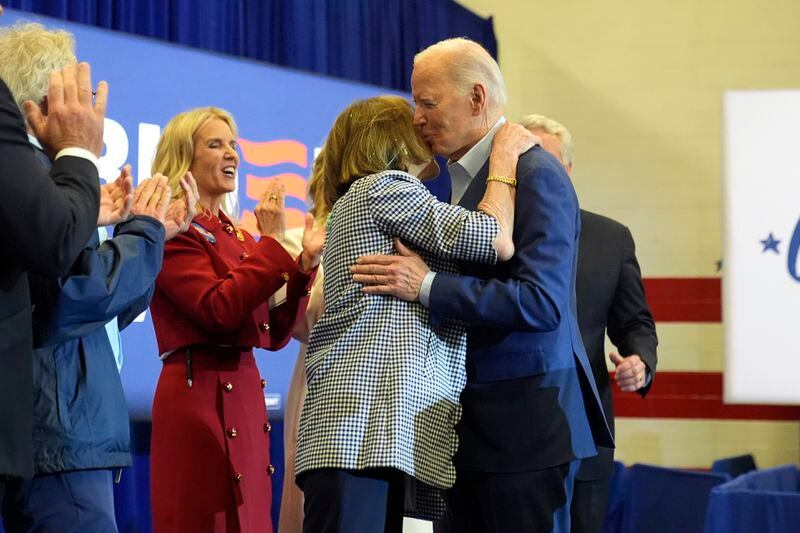 President Joe Biden, right, hugs Kathleen Kennedy Townsend as Kerry Kennedy and members of the Kennedy family look on at a campaign event, Thursday, April 18, 2024, in Philadelphia. (AP Photo/Alex Brandon)