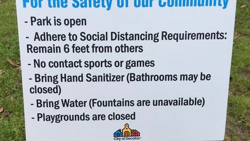 These signs were posted at each City of Decatur Park Tuesday March 24, the same day the city issued an Emergency Stay At Home order. Bill Banks for the AJC