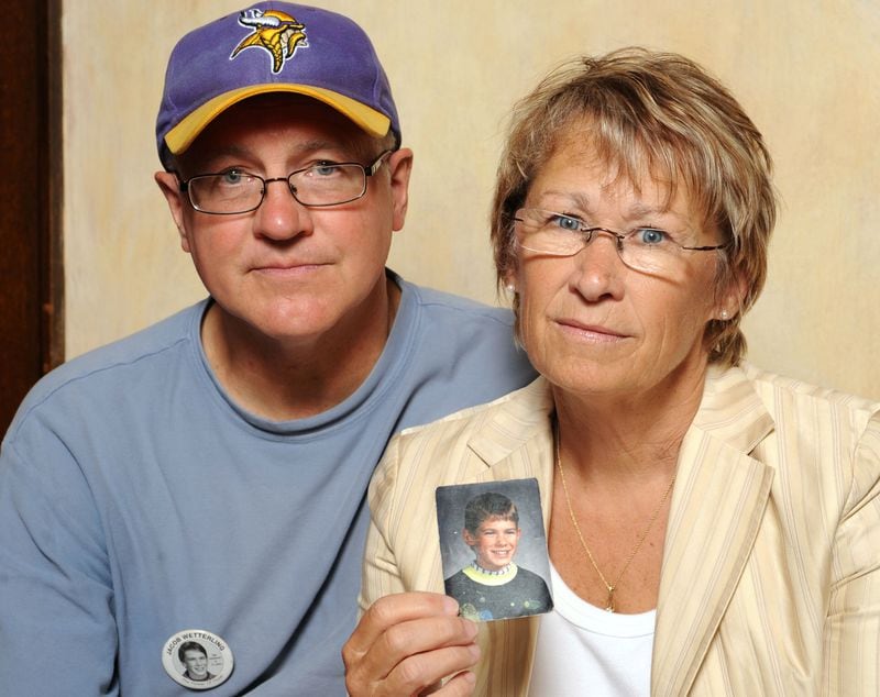 In this Aug. 28, 2009, file photo, Patty and Jerry Wetterling display a photo of their son, 11-year-old Jacob Wetterling, who was abducted Oct. 22, 1989, in St. Joseph, Minnesota. His disappearance remained unsolved until the fall of 2016, when Danny James Heinrich, who became a person of interest in 2015 after being arrested on child pornography charges, confessed to killing the missing boy and led police to Jacob’s remains, which were buried on a farm about 30 miles from the site of his abduction. Heinrich, 55, is serving a 20-year sentence on a child porn charge.