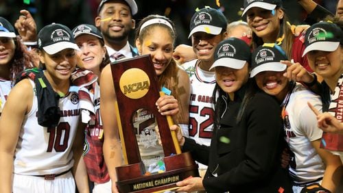 A'ja Wilson (left) and head coach Dawn Staley of the South Carolina Gamecocks hold the NCAA trophy after winning the championship game against the Mississippi State Lady Bulldogs of the 2017 NCAA Women's Final Four at American Airlines Center on April 2, 2017 in Dallas.