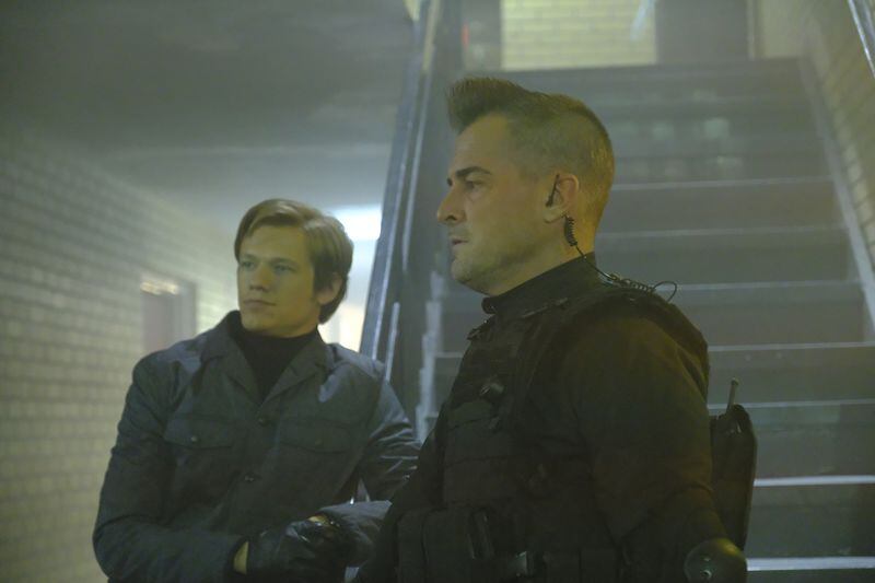  "Hole Puncher" -- When the team intercepts a terror group's message meant for Murdoc, Mac poses as the psychopath to save the intended target and find out why they want Murdoc to assassinate him, on MACGYVER, Friday, April 7 (8:00-9:00 PM, ET/PT) on the CBS Television Network. Pictured: Lucas Till, George Eads. Photo: Guy D'Alema/CBS ÃÂ©2017 CBS Broadcasting, Inc. All Rights Reserved