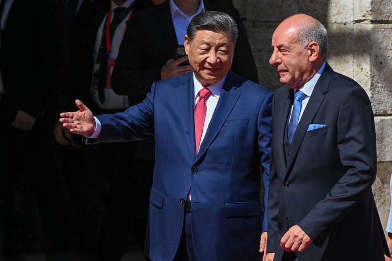 Hungarian President Tamas Sulyok, right, receives Chinese President Xi Jinping, left, with military honours in the Lion Court of the Castle of Buda in Budapest, Thursday, May 9, 2024. (Zoltan Mathe/MTI via AP)