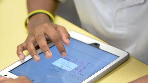 File: Sixth-grader Julian Trowel, 12, works on his iPad during math class. Students at Ronald McNair Middle school in Fulton County use iPads in their classes, Thursday, January 14, 2016.  KENT D. JOHNSON/ kdjohnson@ajc.com