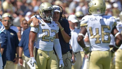 Georgia Tech head coach Paul Johnson instructs running back Melvin Davis (23) in the second half of the opener against Alcorn State on Saturday, Sept. 1, 2018, at Bobby Dodd Stadium in Atlanta.