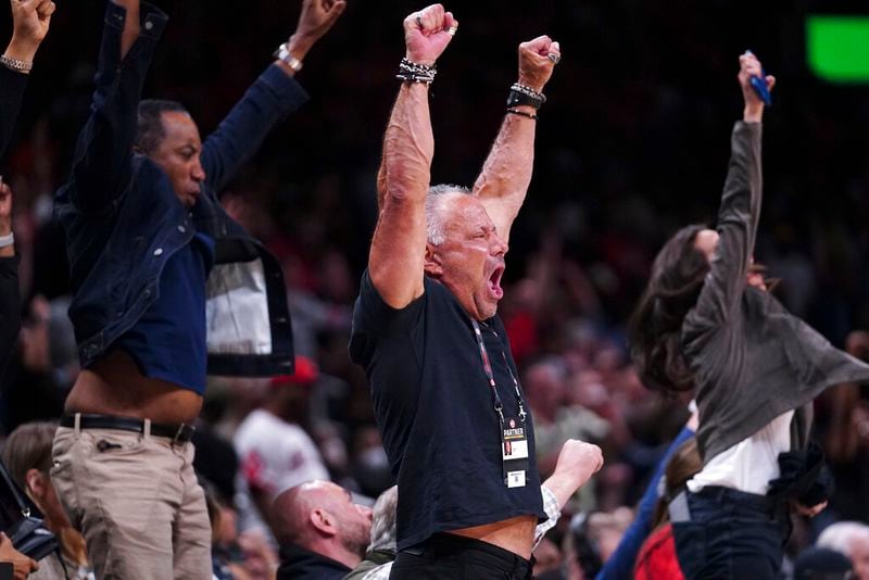 Atlanta Hawks fans react after a Hawks basket in the final moments of the second half in their win over the Chicago Bulls in an NBA basketball game Thursday, March 3, 2022, in Atlanta. (AP Photo/John Bazemore)