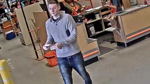 Johns Creek police are searching for a man who they say used a stolen credit card to purchase thousands of dollars worth of gift cards.