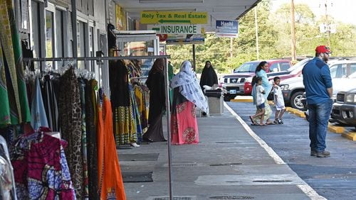 One of the Somali nationals who were recently arrested by federal immigration authorities worked at a barber shop here at Campus Plaza in Clarkston. The shopping center is popular among Somali immigrants. HYOSUB SHIN / HSHIN@AJC.COM