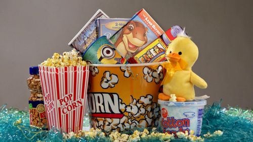 One way to keep sugar in check is to go with a movie-themed Easter basket. Start with an oversized popcorn container, and fill it with kids DVDs, a yellow duck stuffed animal, a “Despicable Me” 16-ounce drinking cup (or one from a similar movie), cotton candy, a box of animal cookies and popcorn holders. J.B. FORBES / ST. LOUIS POST-DISPATCH / TNS