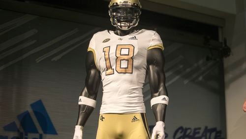The new Georgia Tech football uniforms are displayed at Ventanas during a uniform reveal party in Atlanta, Friday, August 3, 2018. The university collaborated with Adidas to create new uniforms for the 2018 season.  (ALYSSA POINTER/ALYSSA.POINTER@AJC.COM)