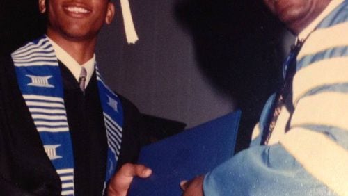 Karvis Jones receives his bachelor's degree in mass communications and broadcast journalism in 2003 from Rust College President David Beckley. "My way of giving back to the Holly Springs community came back into full circle when I received my degree."