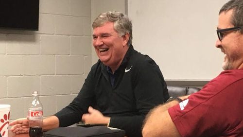 Former Georgia Tech coach Paul Johnson shares a laugh with Lassiter High assistant coach Michael Helmly in a meeting at the school Dec. 9, 2019. The coaching staff sought Johnson's knowledge as it considers running an offense similar to Johnson's. (AJC photo by Ken Sugiura)