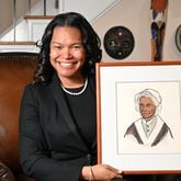 Sojourner Grimmett holds a drawing of Sojourner Truth that was drawn by her grandmother at her home, Thursday, Feb. 2, 2023, in Atlanta. Sojourner Grimmett was named after Sojourner Truth by her father, a noted scholar of black studies and biographer of Malcolm X. She says the name has had an impact on her life and her career. (Hyosub Shin / Hyosub.Shin@ajc.com)