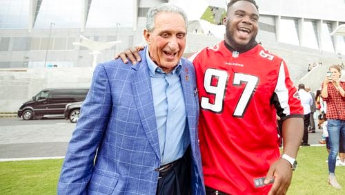 Falcons owner Arthur Blank and Falcons defensive tackle Grady Jarrett celebrated the opening of The Home Depot Backyard, next to Mercedes-Benz Stadium, on Tuesday.