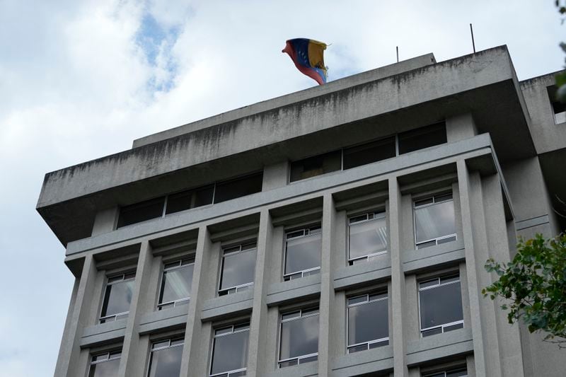 The Venezuelan flag flies over the building where the Venezuelan embassy is located in Quito, Ecuador, Tuesday, April 16, 2024. Venezuelan President Nicolás Maduro ordered the closure of his country's embassy and consulates in Ecuador on Tuesday in solidarity with Mexico in its protest over a raid by Ecuadorian authorities on the Mexican embassy in Quito. (AP Photo/Dolores Ochoa)