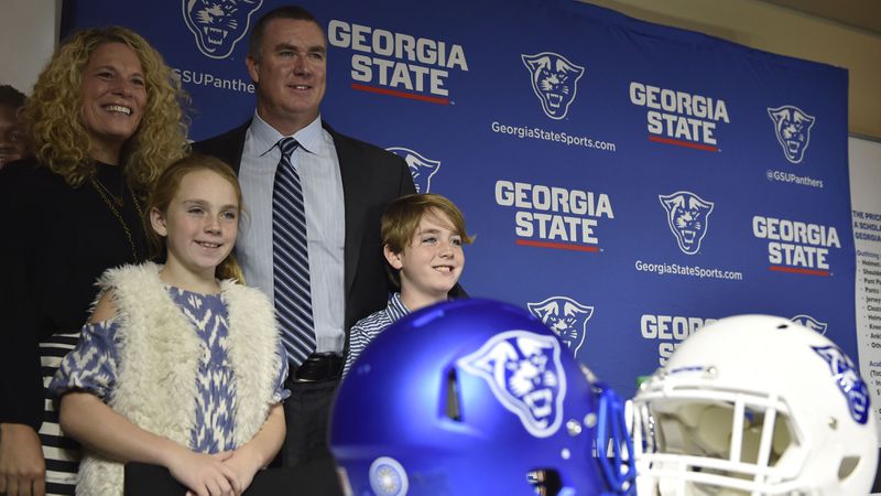 Shawn Elliott poses for a portrait with his family after a press conference where he was introduced as the head football coach for Georgia State on Friday, December 9, 2016. (DAVID BARNES / AJC file)