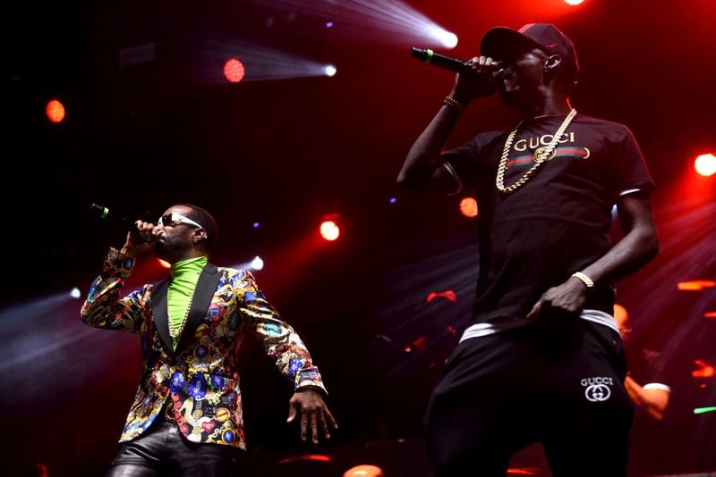Juicy J (left) and Crunchy Black (right), members of the Academy Award winning rap group Three 6 Mafia, helped kick off day one of One Musicfest at Centennial Park. The music festival is celebrating is 10th anniversary. RYON HORNE/RHORNE@AJC.COM