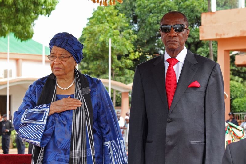 Liberia President Ellen Johnson Sirleaf, left, appeared in Guinea on Aug. 1, 2014. (Youssouf Bah/AP)