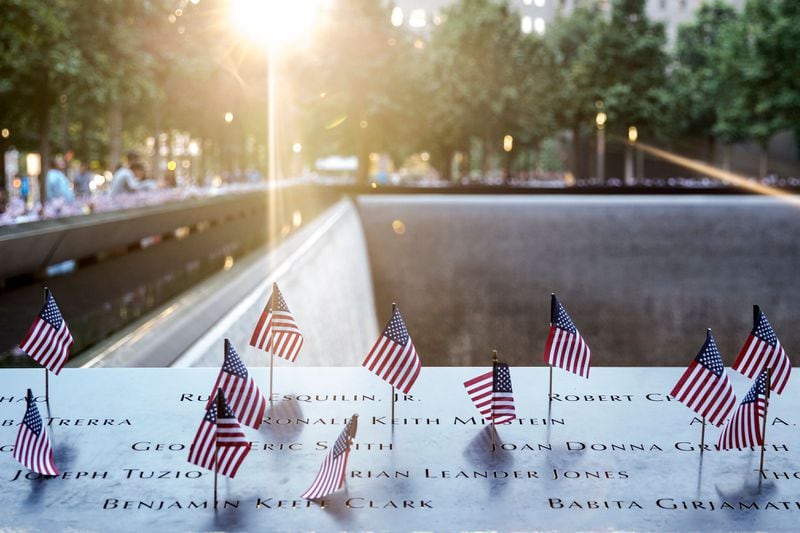 Small American flags are placed in all 2,983 names on the 9/11 Memorial in the Manhattan borough of New York City. The flag placement has become an annual tradition at the site on July 4. (Photo by Alex Wroblewski/Getty Images)