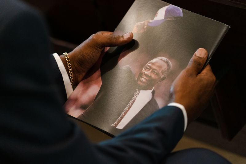 An attendee holds a program for the funeral services of Henry "Hank" Aaron, longtime Atlanta Braves player and Hall of Famer, on Wednesday, Jan. 27, 2021 at Friendship Baptist Church in Atlanta. Photo by Kevin D. Liles/Atlanta Braves