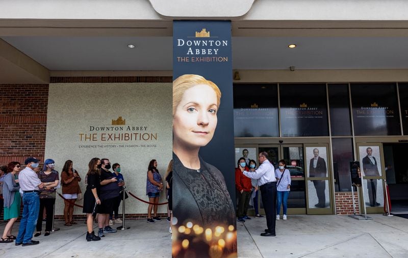 In line to see the show, patrons of Downton Abbey: The Exhibition wait in Sandy Springs for doors to open at the experiential, traveling show Saturday, Oct 2, 2021.  The presentation in Atlanta is the largest showing on the national tour with two additional rooms on display from the television series' film set, as well as more fashion shown that was used in the PBS show and prop artifacts from the iconic house. (Jenni Girtman for The Atlanta Journal-Constitution)
