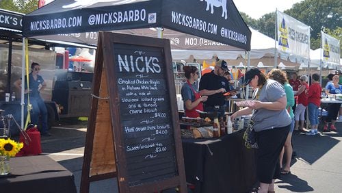 Taste samples from Cobb County area restaurants at recent Taste of Kennesaw event. While jobless claims have fallen, restaurants remain one of the largest contributors to filings for unemployment benefits. But overall, the economic rebound has been strong in metro Atlanta.