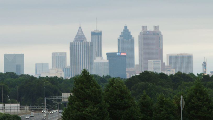 Trees sit below the Atlanta skyline as cars drive by on June 12, 2019. (credit: Christina Matacotta)