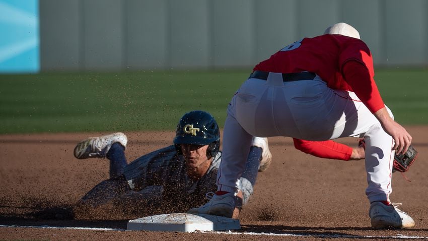 Georgia Tech's Jett Lovett slides into third base during the 20th Spring Classic game on Sunday at Coolray Field in Lawrenceville. (Jamie Spaar / for The Atlanta Journal-Constitution)
