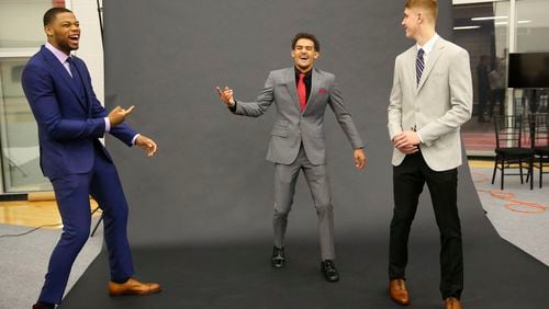 Hawks top draft pick Trae Young is at the center of a light-hearted photo shoot in Atlanta with fellow picks Omari Spellman, left, and Kevin Huerter.