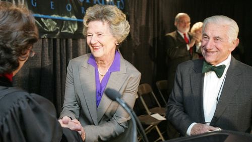Dr. John Galambos, right, stands beside his wife of six decades, Sandy Springs' first mayor Eva Galambos, as she's sworn in the night the city was incorporated. Dr. Galambos died surrounded by his family May 29, 2019.