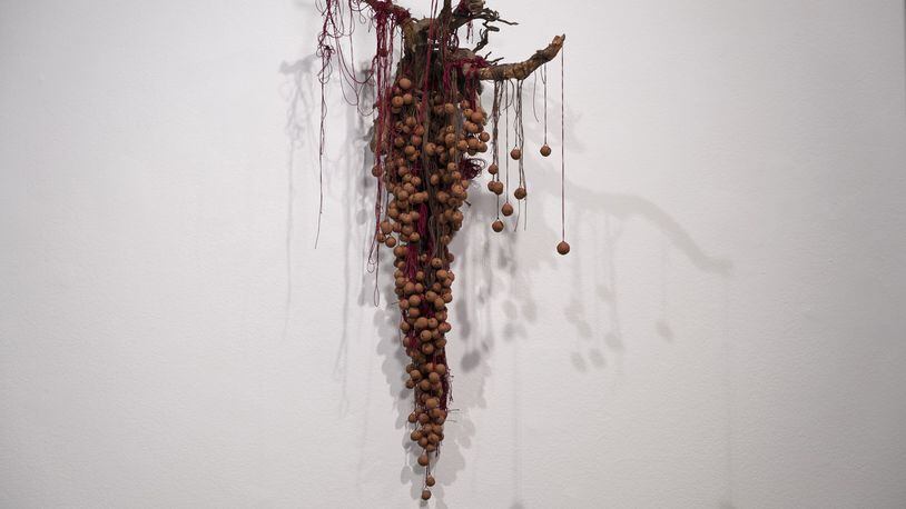 Sonya Yong James’ artwork “Home,” features root, Georgia red clay and cotton thread. Photo credit: Ashley Kauschinger