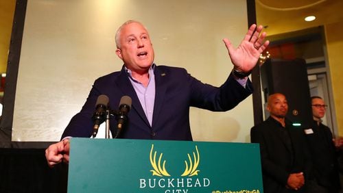 Bill White, leader of the Buckhead cityhood movement, addresses supporters during a fundraiser last month at Bistro Niko in Buckhead. White's leadership role in the movement has drawn new attention to his finances, including a settlement agreement and his work on veterans issues. (Curtis Compton / Curtis.Compton@ajc.com)