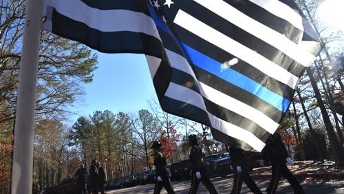 Hundreds of police officers from around Georgia attend the funeral service of officer Edgar Isidro Flores at All Saints Catholic Church in Dunwoody on Tuesday, December 18, 2018. Flores was shot and killed in DeKalb County in the line of duty.